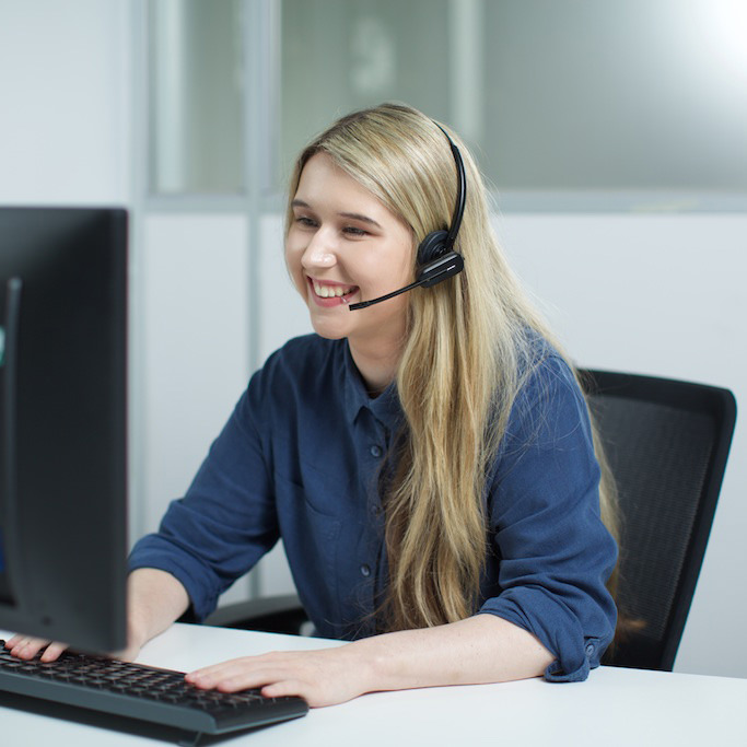 Lady with a headset on smiling